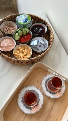 two trays filled with different kinds of food