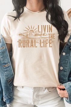 Experience the simple joys of country living with our Livin The Rural Life Western Farm Graphic Tee. Most t shirt colors are 52/48 cotton/poly blend. White and Cream tees are 100% cotton, Ash tees are 99/1 cotton/poly. The classic fit ensures comfortable wear for any rural activity, from farm work to bonfires. Perfect for any country dweller or those who appreciate the rural lifestyle, this tee is a must-have for anyone who loves the simple pleasures of the countryside. Made In: USA Fabric Conte Unisex Graphic Tees, Farm Clothes Aesthetic, Laura Farms, Western Tshirt Designs, Farm Merch, Cricut Tshirt Ideas, T Shirt Colors, Dtf Shirts, Farm Shirts