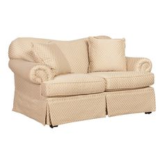 a couch with two pillows on it and a skirted armrest in the back