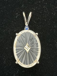 Beautiful Nee Hampshire quartz crystal stone with .01 point diamond in 10k white gold plate with 2.5 mm genuine sapphire on top. Blue Sapphire Pendant, Sapphire Pendant, Pittsburgh Pa, Crystal Stone, Hampshire, Stones And Crystals, Pendant Necklaces, Quartz Crystal, Pittsburgh