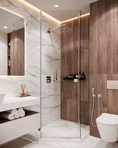 a modern bathroom with marble walls and flooring