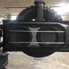 the back end of a truck with speakers on it