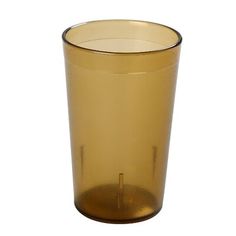 a gold colored glass is shown against a white background