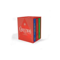 three christmas books sitting next to each other on top of a white surface with the words christmas in red, green and blue