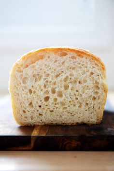 a piece of bread sitting on top of a cutting board