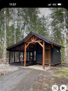 an image of a small cabin in the woods