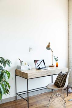 an image of a desk with a laptop on it