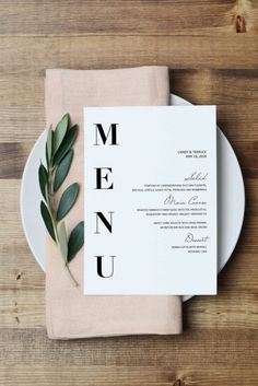 a plate with a menu on top of it next to a fork and knife in front of a napkin