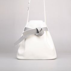 Stylish and elegant, ITOSHIOSHI Bucket Bag from KITAYAMA Studio is featured by its minimalistic design. To limit the use of metal accessory meant to emphasize the nature and purity of the leather. This designer handbag is an eye-catching item for styling. Made of full-grain calf leather and lined with suede lambskin, this bag brings you an elegant look with a quality interior. All Kitayama leather goods are designed and handcrafted in small quantity by experienced craftsmen in the studio and carefully inspected before sending to the customer. KITAYAMA Studio is a handcrafted leather goods brand established in 2015. KITAYAMA designers work with highly experienced craftsmen and utilise genuine premium-quality leather to create designer leather goods. KITAYAMA design emphasises the beauty of Designer Handbag, Metal Accessories, Handcrafted Leather, In The Studio, Leather Design, Good Brands, Leather Interior, Best Brand, Leather Goods