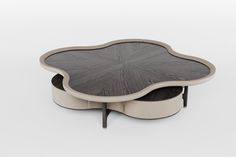 an artistically designed coffee table is shown in grey and white color scheme, with two matching tables on each side