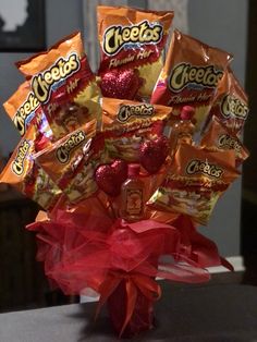 a bouquet of candy wrapped in red ribbon