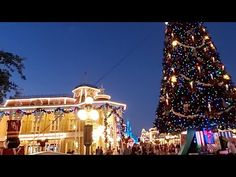 a large christmas tree in the middle of a street