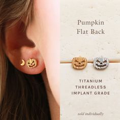 Flat Back Earrings * F136 implant-grade titanium * Hypoallergenic, waterproof 24/7 wear * 18k gold PVD plating * 6mm or 8mm post length * 18 gauge post thickness, 3mm round back * Push pin style is tension set, see instructions below * Pumpkins measures 7 x 6 mm * Sold per earring (individually) Our Threadless Flat Backs are made with ASTM F136 implant-grade titanium. Made for the most sensitive ears, hypoallergenic, medical grade and waterproof. Push pin, labret style stud backs are inserted th Nap Earrings, Tension Setting, Flat Back Earrings, Design Stamps, Halloween Earrings, Saint George, Push Pin, Sensitive Ears, Jack O Lantern