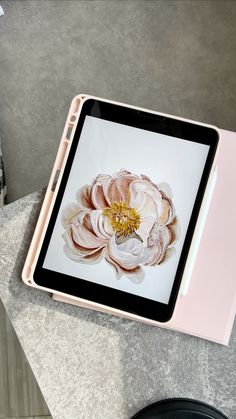 an open tablet computer sitting on top of a table