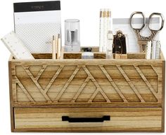 a wooden desk organizer with scissors and other office supplies