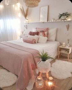 a bedroom with white walls and pink bedding