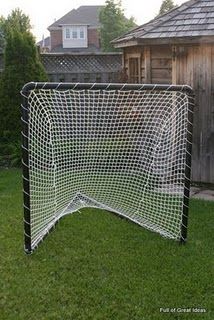 an outdoor soccer goal in the yard