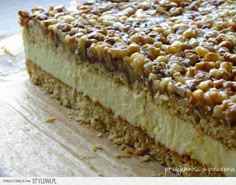 a close up of a piece of cake on a cutting board with other food items