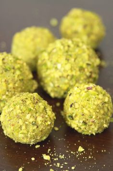 several balls of food sitting on top of a wooden table