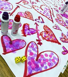 the paper is covered with hearts and other crafting supplies for valentine's day