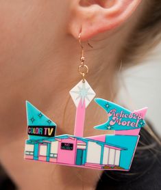 Indulge in a nostalgic trip down memory lane with these 70s Retro Relic828 Kitschy Motel Earrings. Inspired by the quirky and colorful motels of the era, these earrings feature a unique design that captures the retro charm of the 70s. Crafted from lightweight acrylic, these earrings offer comfort without compromising on style. The hooks are made of stainless steel, coated in 18k gold for a touch of luxury, and are nickel-free to ensure a comfortable wearing experience. Product Details: Size: Eac 70s Nostalgia, Retro Earrings, Retro Earring, Pretty Jewelry, 70s Retro, Colorful Earrings, The 70s, Program Design, Acrylic Material