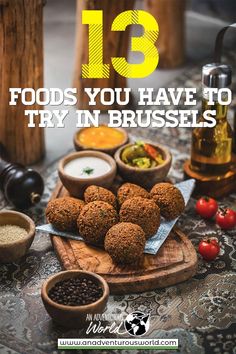 some food is sitting on a table with the words 13 foods you have to try in brussels