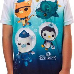 a young boy wearing an octonauts t - shirt with cartoon characters on it