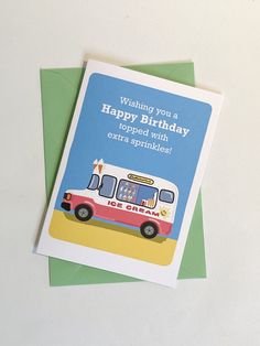 a birthday card with an image of a bus on the front and back, which reads wishing you a happy birthday