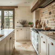 a large kitchen with white cabinets and marble counter tops, along with an open window to the outside