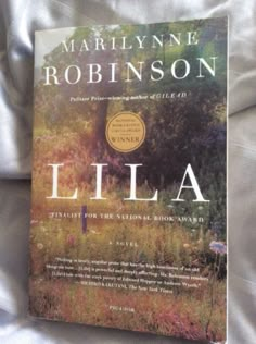 the book cover for lila by marilynne robinson, winner of the national book award