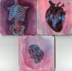 four coasters with different types of artwork on them, including a skeleton and a human heart