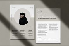 an image of a professional resume on a grey background with shadows coming from the pages