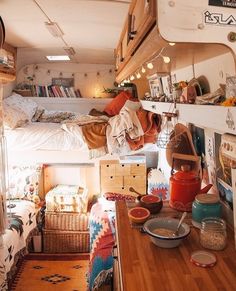 the inside of a camper with bunk beds and other items on it's walls