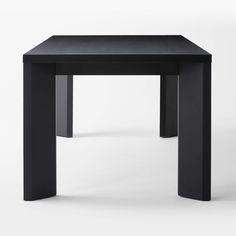 a black square table with two legs on the top and one leg up against it