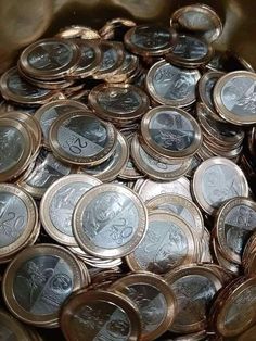 a bunch of coins that are in a bucket