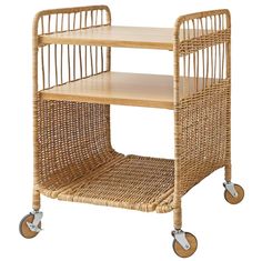 a wicker bar cart with two shelves on wheels