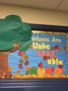 a bulletin board with an image of a tree and the words indians are under leaves on it