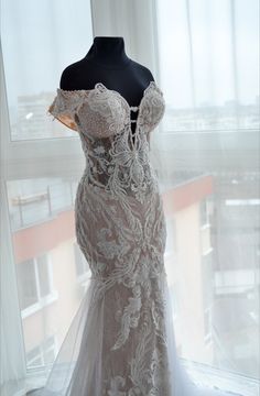 a dress on display in front of a window