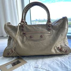 For Sale $2200 Current Retail Price For A Large Le City On Balenciaga Website: $3,250 Brand: Balenciaga Le City Large Colour: Beige Material: Leather Includes Balenciaga Dustbag This Bag On Offer Is A Beautiful, Versatile Beige Bag, In A Large Size. It Was Worn Twice And Then Stored In Its Balenciaga Dustbag It Is In Perfect Condition Exterior: Beautiful, Rare Rose Gold Grommet Hardware, Undamaged, No Scratches Or Scuff Marks The Handles Are In Perfect Condition And The Braiding Is Perfect , Unw Beige Handbag, Bags Balenciaga, Rare Roses, Beige Handbags, Mirror Framed, Small Mirror, Beige Bag, Shades Of Beige, Balenciaga Bag