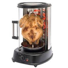 a chicken is being cooked in an electric blender with the lid open to show it's inside