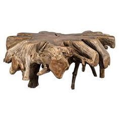 a piece of wood that has been carved into a table with some branches on it