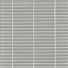 a white tile wall with horizontal lines on it