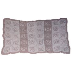 a crocheted pillow is shown on a white background and it has a light brown border