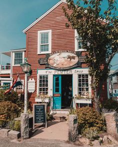 a red building with a blue door and windows