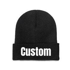 a black beanie hat with the word custom printed on it in white letters, against a white background