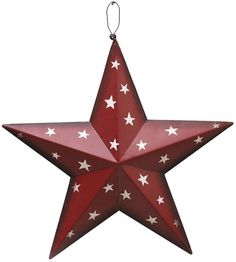 a red and white star ornament hanging from a string