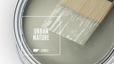 a paint can with a brush in it and the words urban nature painted on it