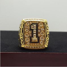 a gold ring with the number one on it