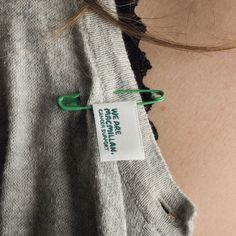 there is a label on the back of a sweater that says, no matter what it means