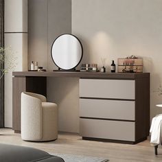 a white and brown dresser in a living room next to a mirror on the wall